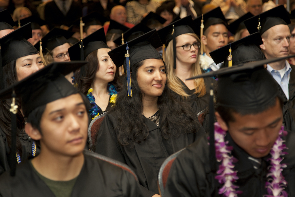 students sitting during graduation ceremony